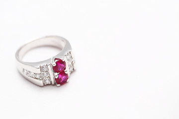 Pink gem stone on diamond ring