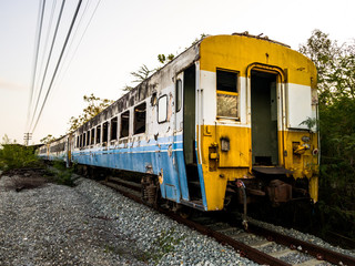 Fototapeta na wymiar Old bogey of retired train park at the inactive railroad