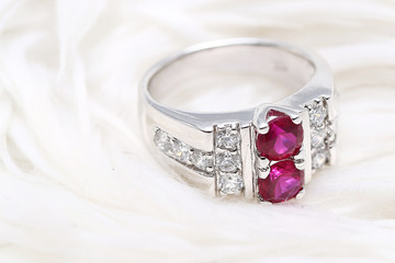 Pink gem stone on diamond ring