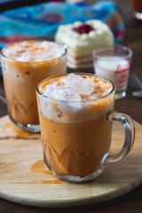 thai tea milkshank sweet drink on the glass for refreshment