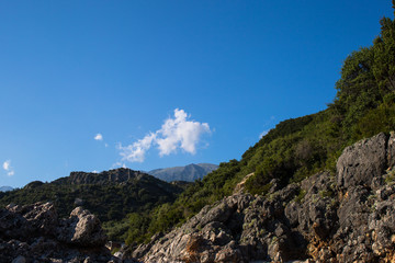 Obraz premium Aerial view of sea waves and fantastic rocky coast,Albania wakacje