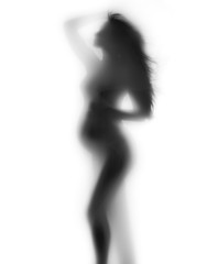 Pregnant woman shadow portrait isolated on white background. Silhouette of pregnant woman touching her belly. Pregnancy concept. Baby Shower