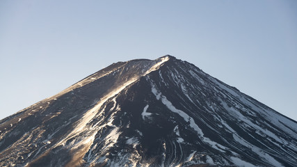 Mount Fuji with less snow on top of its peak. Fuji is a most famous mountain in Japan.