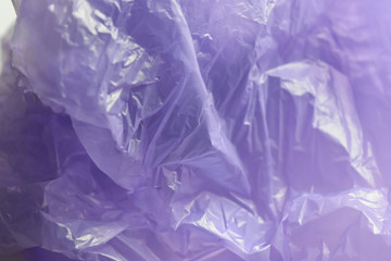 Purple plastic background with crystal clear and crumpled.