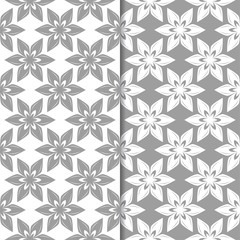 White and gray floral ornaments. Set of seamless backgrounds