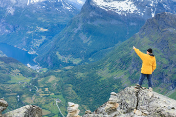 Tourist man on Dalsnibba viewpoint Norway