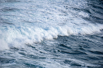 Wave form and water splash created by vessel sail through the sea or ocean