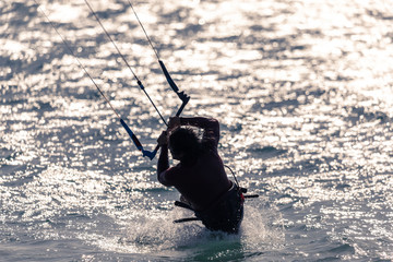 A silhouette of a kitesurfer in Tarifa, Spain. 