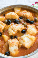 Salted cod stewed with olives