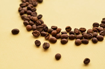 coffee beans in a circle on a yellow background with a place under the text