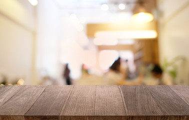 Empty dark wooden table in front of abstract blurred bokeh background of restaurant . can be used for display or montage your products.Mock up for space.