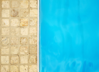 Background tiles and fresh cool blue pool water. Background, copy space.