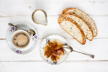Breakfast with coffee on old rural table.