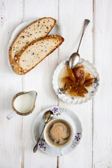 Breakfast with coffee on old rural table.