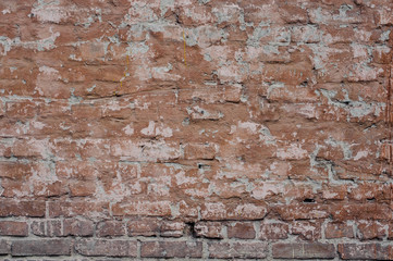 Old dilapidated exterior wall painted in brown