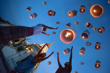 lanterns ballon release by people floating to blue sky for make a wish for the future, Thailand