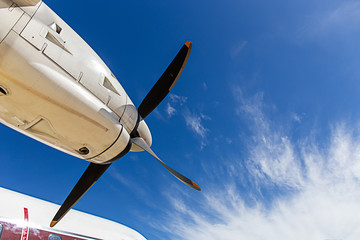 view of aircraft propeller blade and turboprop engines with blue sky background
