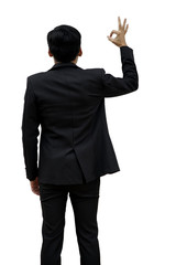 Rear view of a male businessman lifting a hand sign OK