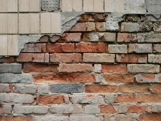 olonne / Ukraine - 06 August 2018: old brick wall with a tiled top
