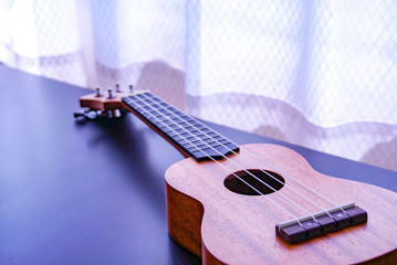 Ukulele in the natural day light by the window