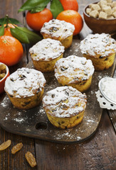 Mandarin muffins with raisins on the table