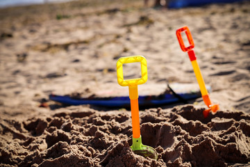 Toy spades at the beach
