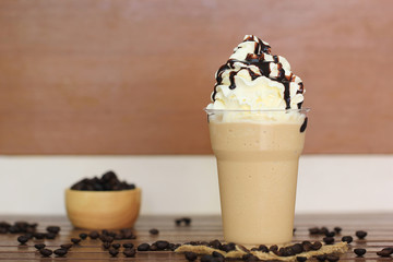 ice coffee and caramel smoothie on table in coffee shop.