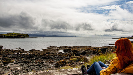 Young women on mountain top looking at panoramic view