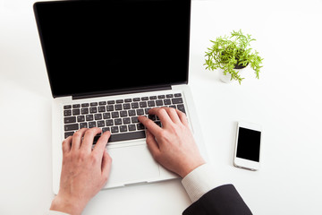 Man hand on laptop keyboard