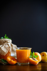 fresh sweet apricot jam on a wooden table
