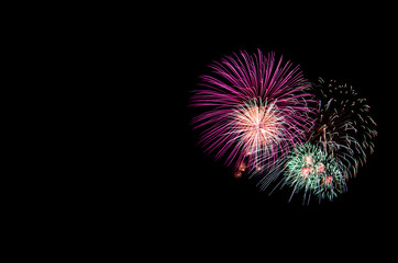 colorful fireworks on the black sky background over-water