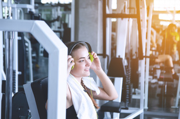 Young woman choosing music for sports training