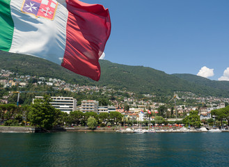 Fototapeta premium Italian flag waving on the deck of a ship sailing on Lake Maggiore