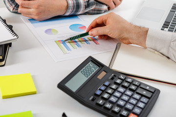 Business concept. Two business mans working and meeting with chart at office on his desk.