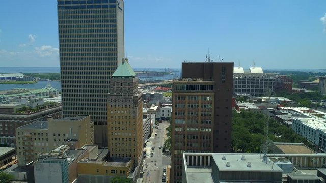 Aerial drone flying low through downtown towers Mobile Alabama USA