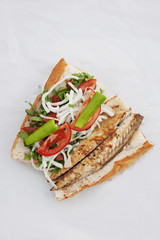 Fish in bread with fresh vegetables, Istanbul street food
