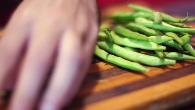 man cut green beans close up
