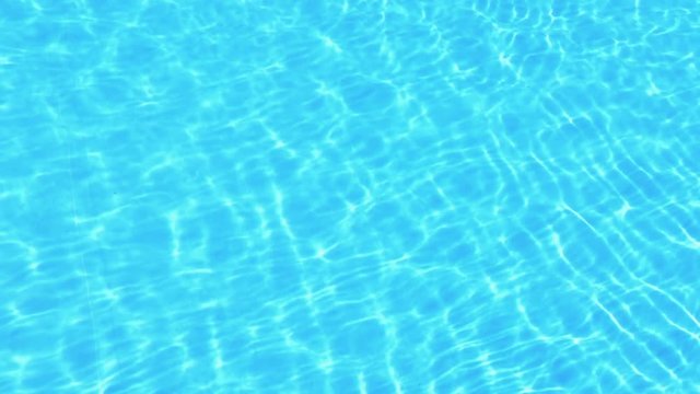 Refreshing blue swimming pool water