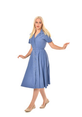 Fototapeta premium full length portrait of blonde girl wearing blue dress. standing pose. isolated on white studio background.