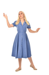 Naklejka premium full length portrait of blonde girl wearing blue dress. standing pose. isolated on white studio background.