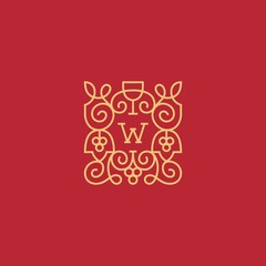Gold monogram of grapes on a red background.