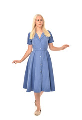 full length portrait of blonde girl wearing blue dress. standing pose. isolated on white  studio background.