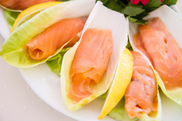 Salmon starter served on a cabbage leaf