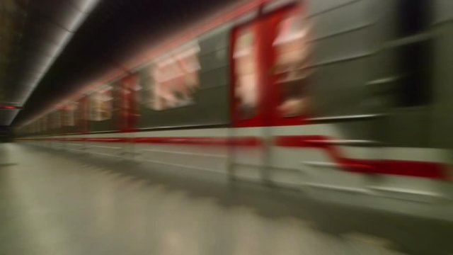 Subway Train with Passengers Arriving to Underground Metro Station, Motion Blur