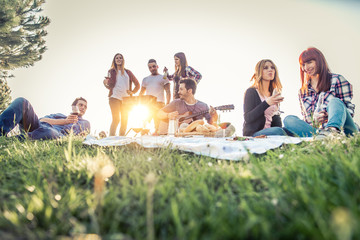 Friends doing picnic and grilling outdoors