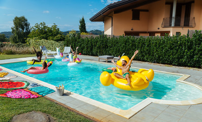 Friends having fun in a swimming pool