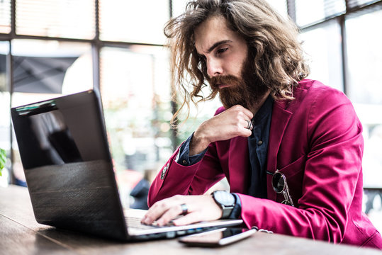Hipster man working at computer