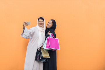 Two arabian girlfriends bonding and having fun