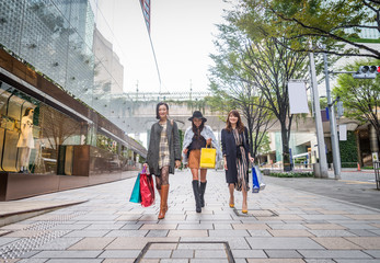 Naklejka premium Women shopping in Tokyo