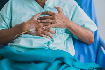 pain and heartburn old senior asian grandfather in patient uniform suffer from body problem  health...